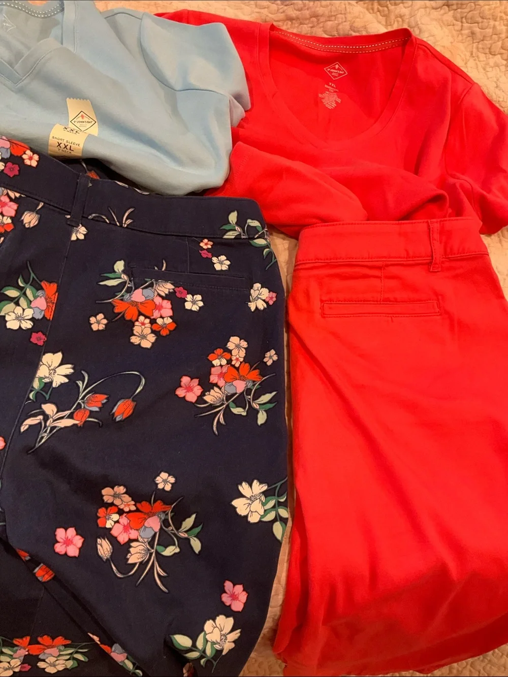 Coral Red V-Neck Top with Floral Navy Pants and Light Blue Tee